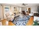 Spacious living room showcasing hardwood floors, a ceiling fan, and a classic area rug at 1376 Highway 138 E, Stockbridge, GA 30281