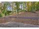 Wooden back deck overlooking the spacious yard with mature trees and foliage at 2740 Pasco Se Ln, Atlanta, GA 30316