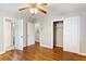 Bedroom featuring hardwood floors, ceiling fan, and closets for ample storage space at 2740 Pasco Se Ln, Atlanta, GA 30316