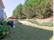Spacious backyard featuring lush greenery and a patio area at 801 Rutledge Ct, Woodstock, GA 30188