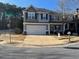 Charming two-story home with a two-car garage, a well-manicured lawn, and a welcoming front porch at 801 Rutledge Ct, Woodstock, GA 30188
