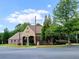 Brick Firestation on corner lot, with sign on building and trees on property at 801 Rutledge Ct, Woodstock, GA 30188