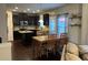 Stylish kitchen with dark cabinetry, granite countertops, a center island, and an adjacent dining area at 801 Rutledge Ct, Woodstock, GA 30188