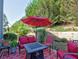 Cozy patio with stylish outdoor furniture and a fire pit, ideal for entertaining guests at 801 Rutledge Ct, Woodstock, GA 30188