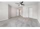 Empty bedroom with neutral walls, carpet, ceiling fan, and a closet with double doors at 2011 Farm Hill Ct, Stockbridge, GA 30281