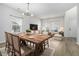 Bright dining area featuring a large wooden table and a view to the living room, perfect for gatherings at 2011 Farm Hill Ct, Stockbridge, GA 30281