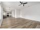 A bright interior with a kitchen and living area offers an open-concept floor plan and modern design at 2011 Farm Hill Ct, Stockbridge, GA 30281