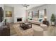 Bright living room with a fireplace, comfortable seating, and natural light, creating a cozy and inviting space at 2011 Farm Hill Ct, Stockbridge, GA 30281