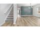 Modern home interior showcasing wood floors, stylish accent wall, and contemporary lighting fixtures at 2011 Farm Hill Ct, Stockbridge, GA 30281