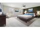 Comfortable bedroom features modern decor, a ceiling fan, and neutral-colored walls at 2011 Farm Hill Ct, Stockbridge, GA 30281