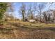 Wide open property, with a few surrounding trees, has potential for development at 2454 Donald Lee Hollowell Nw Pkwy, Atlanta, GA 30318