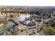 An aerial view of a neighborhood featuring mature trees, a pond, pool and tennis courts at 6305 Deerwoods Trl, Alpharetta, GA 30005