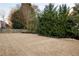 Lush backyard featuring well-maintained lawn and mature trees at 6305 Deerwoods Trl, Alpharetta, GA 30005