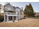 Stunning backyard view showcasing a well-manicured lawn, patio, and deck at 6305 Deerwoods Trl, Alpharetta, GA 30005
