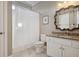 Clean bathroom showcasing granite countertops, and decorative mirror at 6305 Deerwoods Trl, Alpharetta, GA 30005