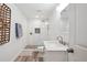 Modern bathroom featuring a walk-in shower with subway tile, stone flooring, and a floating vanity at 6305 Deerwoods Trl, Alpharetta, GA 30005