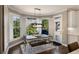 Charming breakfast nook with a farmhouse table, bench seating, and bright natural light at 6305 Deerwoods Trl, Alpharetta, GA 30005