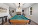 Attractive game room features billiard table, fireplace, and comfortable counter seating at 6305 Deerwoods Trl, Alpharetta, GA 30005