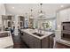 Spacious kitchen with a large island, stainless steel appliances, and modern lighting at 6305 Deerwoods Trl, Alpharetta, GA 30005