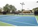 Enjoy tennis on this community's well-maintained court with lighting and adjacent building at 6305 Deerwoods Trl, Alpharetta, GA 30005