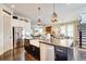 Spacious kitchen with stainless steel appliances, farmhouse sink, and island seating at 164 Inwood Walk, Woodstock, GA 30188