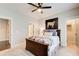 Bedroom with a ceiling fan, a queen bed, and a door to the walk-in closet at 164 Inwood Walk, Woodstock, GA 30188