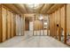 Unfinished basement space showcasing framing, a concrete floor, and a door leading outside at 2557 Tolliver Dr, Ellenwood, GA 30294