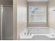 Bathroom featuring a relaxing tub with modern fixtures and a separate shower enclosure at 2557 Tolliver Dr, Ellenwood, GA 30294