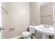 Stylish powder room with pedestal sink and modern fixtures at 2557 Tolliver Dr, Ellenwood, GA 30294