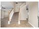 Open foyer featuring a carpeted staircase and tile flooring, providing a grand entrance at 2557 Tolliver Dr, Ellenwood, GA 30294