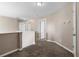 Upstairs hallway showcasing neutral walls and carpet at 2557 Tolliver Dr, Ellenwood, GA 30294