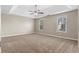 Large main bedroom with trey ceiling, neutral carpeting, and natural light at 2557 Tolliver Dr, Ellenwood, GA 30294