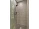 Close-up of a glass-enclosed shower showcasing the tile work and shower fixtures at 45 Ivan Allen Jr Nw Blvd # 1706, Atlanta, GA 30308