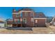 Brick home with a wooden deck and a large backyard at 5594 Mountain View Pass, Stone Mountain, GA 30087