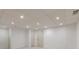 Spacious basement area featuring recessed lighting, neutral carpet, and two doors at 5594 Mountain View Pass, Stone Mountain, GA 30087