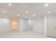 Finished basement area with neutral carpet, closet, and recessed lighting at 5594 Mountain View Pass, Stone Mountain, GA 30087