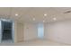 Basement with neutral carpet, white walls, recessed lighting, and a stairway at 5594 Mountain View Pass, Stone Mountain, GA 30087