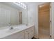 Well-lit bathroom with double sinks, a large mirror, and access to a shower and tub combo at 5594 Mountain View Pass, Stone Mountain, GA 30087