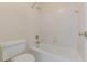 Bathroom with a tub and shower combination, complete with white tiled walls at 5594 Mountain View Pass, Stone Mountain, GA 30087