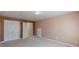 Neutral bedroom with carpet and multiple closet doors at 5594 Mountain View Pass, Stone Mountain, GA 30087