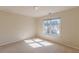 Bedroom featuring natural light and a view of exterior landscape at 5594 Mountain View Pass, Stone Mountain, GA 30087