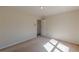 Light bedroom with plush carpet and access to adjacent hall at 5594 Mountain View Pass, Stone Mountain, GA 30087