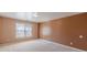 Spacious bedroom features neutral walls, plush carpeting, and a bright window at 5594 Mountain View Pass, Stone Mountain, GA 30087