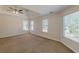 Bright bedroom features three large windows, letting in natural light and offering pleasant views at 5594 Mountain View Pass, Stone Mountain, GA 30087