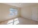 Bedroom with plush carpet and a window overlooking exterior landscape at 5594 Mountain View Pass, Stone Mountain, GA 30087