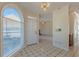 Sunlit entryway with tiled flooring and a view of the living room at 5594 Mountain View Pass, Stone Mountain, GA 30087