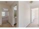 Hallway offering access to the bedroom and a full bathroom at 5594 Mountain View Pass, Stone Mountain, GA 30087