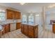 Bright kitchen with wooden cabinets, a center island, and large windows at 5594 Mountain View Pass, Stone Mountain, GA 30087