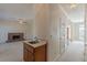 Open floor plan with a cozy brick fireplace and a convenient wet bar at 5594 Mountain View Pass, Stone Mountain, GA 30087