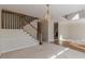 Bright living room with a staircase and hardwood floors adjacent to neutral carpeting at 5594 Mountain View Pass, Stone Mountain, GA 30087